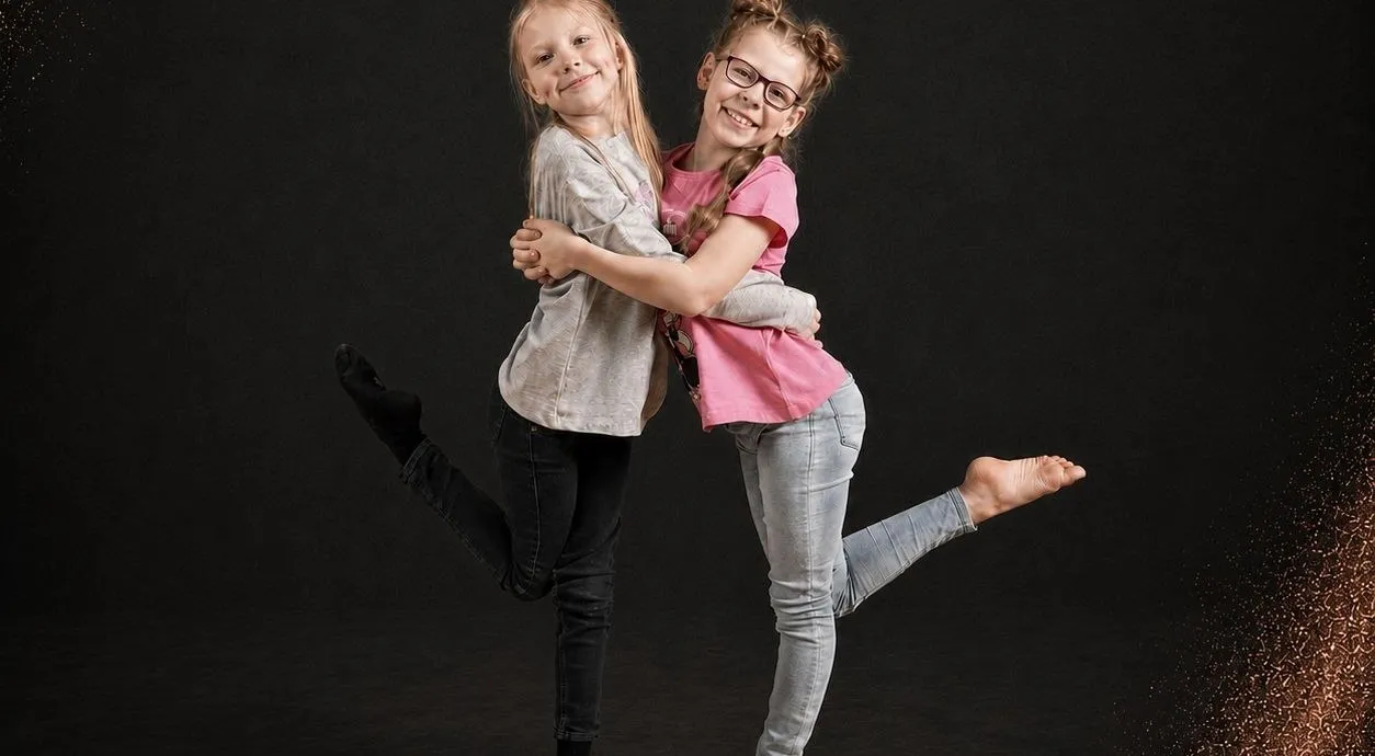 Two children smiling together after dance class